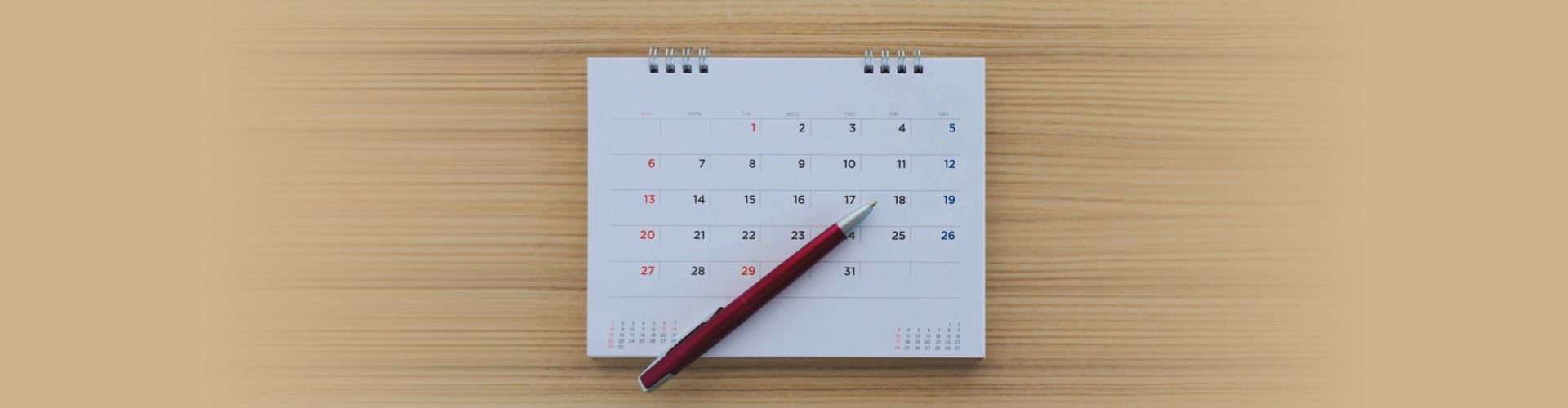 pen on top of a calendar