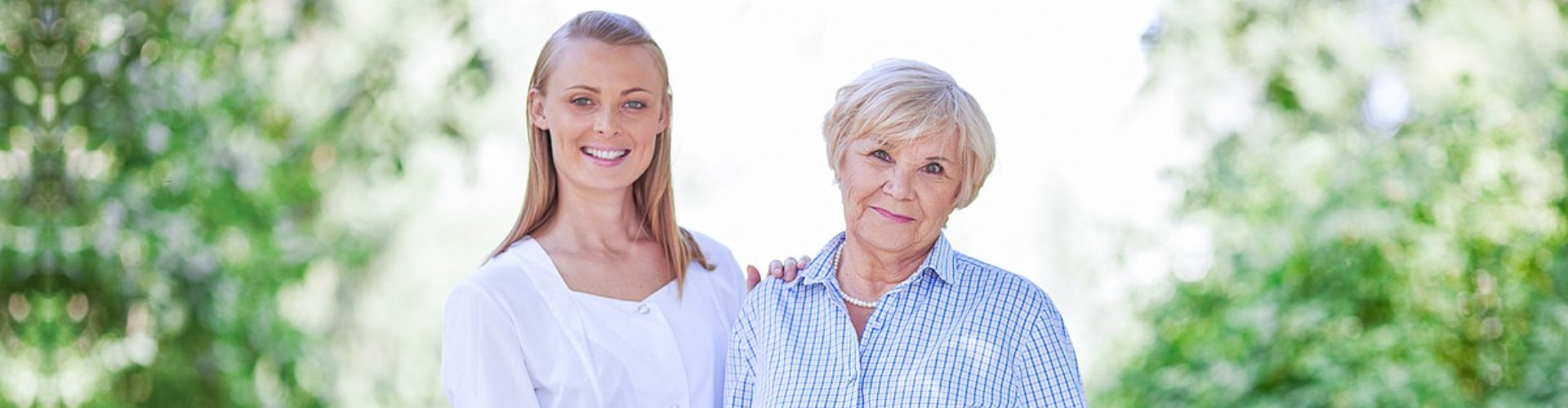 beautiful lady and old woman smiling each other