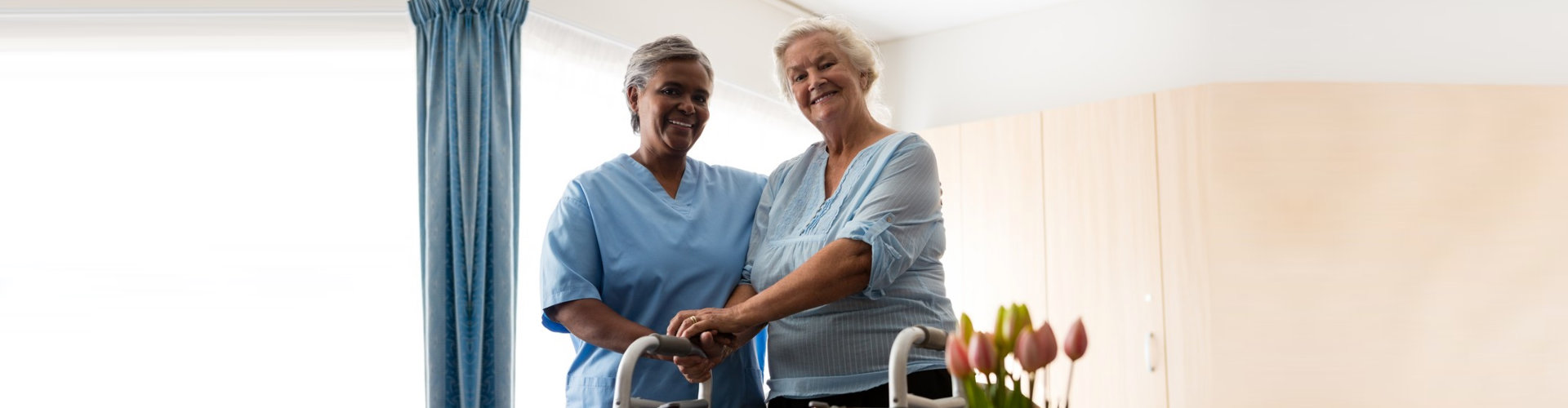 caregiver and senior woman walking